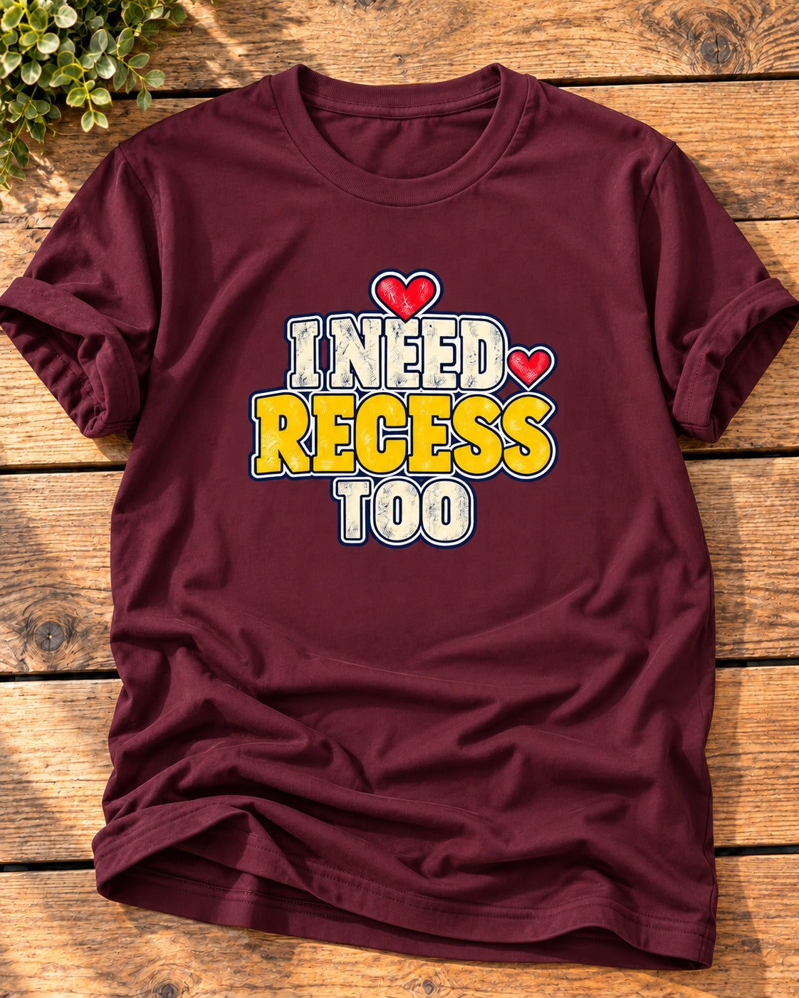Maroon "I Need Recess Too" mom t-shirt with cream and yellow varsity letters